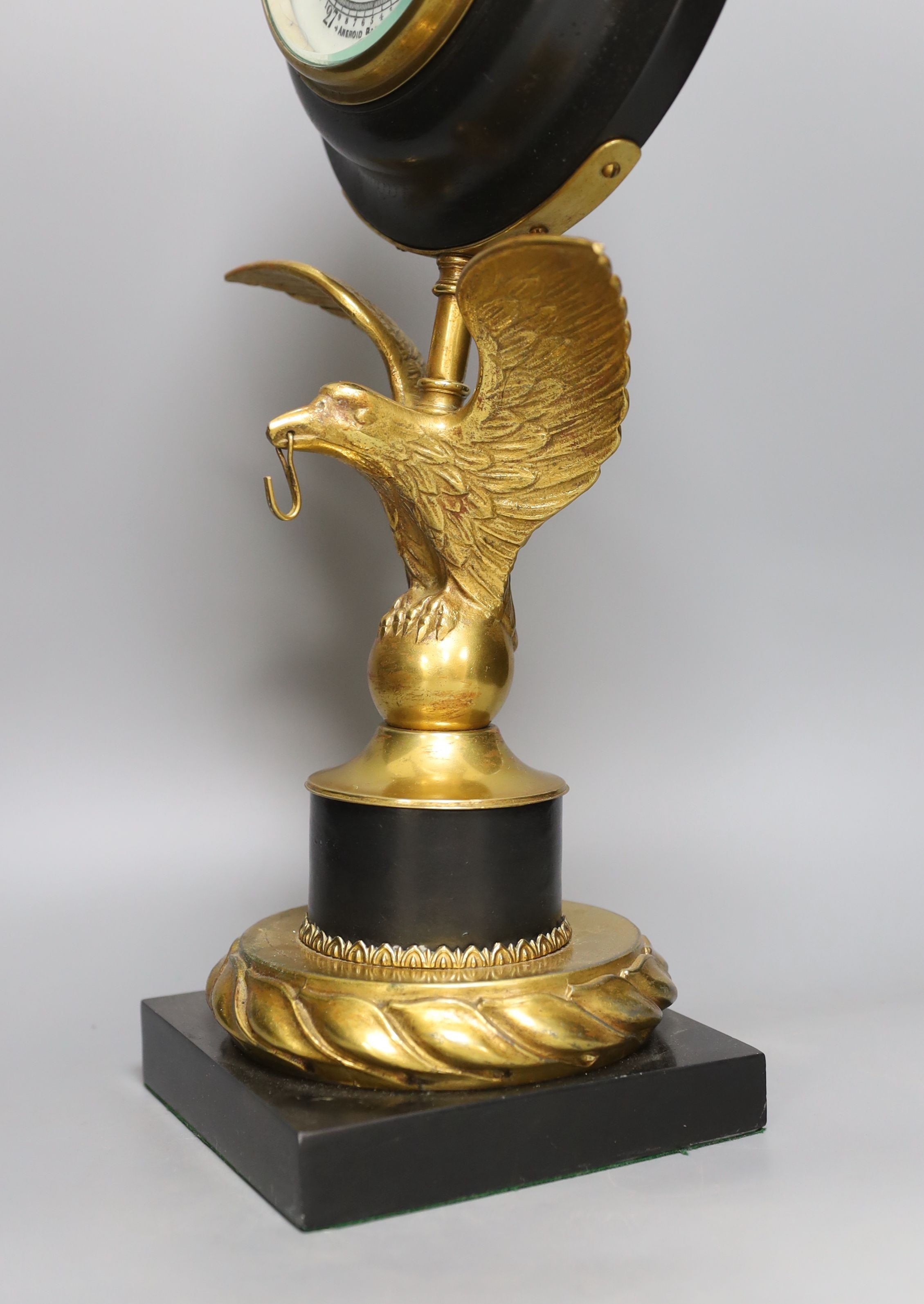 A large desk barometer on a gilt metal eagle mount - 58.5cm tall